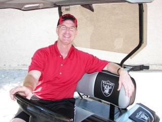 Steve Stallworth, the general manager of the South Point Arena, sits in his custom Oakland Raiders golf cart. The former UNLV quarterback is among a group of locals who will be considered for the next UNLV athletic director post.