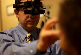 Dr. Jack Abrams examines Mia Johnson, 6, on Friday at his office in Las Vegas. Later this month, Abrams will perform a rare juvenile corneal transplant surgery on Mia, who is legally blind in her right eye.