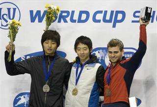 Bronze medal winner Jeff Simon, right, with the United States gold medal winner Jung-Su Lee, center, of South Korea, and silver medal winner Si-Bak Sung, of South Korea, celebrate on Oct. 25, 2008, following the men's 1500-meter final at the World Cup short track speed skating championships in Vancouver.