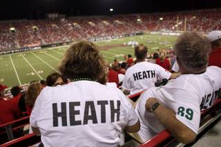 Friends and family of the Heath brothers: Jason of UNLV, and Brian of Sacramento St. watch the action Saturday night at Sam Boyd Stadium.