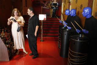 Lisa Striano and Tony Thompson of New York City look at brochures by figures of the Blue Man Group before their 9:09 a.m. wedding at Madame Tussauds Las Vegas Wednesday, Sept. 9, 2009. The wax museum offered free weddings or marriage vow renewals, then offered $99 wedding specials for the remainder of 09/09/09. 