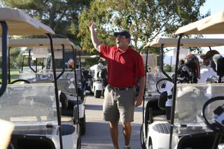 Andrew Levine gathers golfers to their carts Friday at the start of the annual charity tournament he organized in honor of his father at Boulder City Municipal Golf Course. Levine's father, Robert Levine, died Sept. 11, 2001, in the World Trade Center's South Tower in New York.