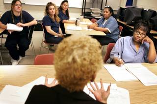 Shizue Hill of the Rape Crisis Center leads a class called Survivors of Abuse and Rape (SOAR) at Florence McClure Women's Correctional Center in North Las Vegas Thursday.