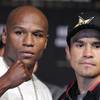 Floyd Mayweather Jr. and Juan Manuel Marquez pose for media members during a press conference at the MGM Grand hotel on Wendesday. The two fighters will face each other Saturday at the MGM Grand Garden Arena.