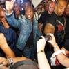 
Boxer Floyd Mayweather Jr., center, makes his way through a crowd of boxing fans in the lobby of the MGM Grand Tuesday after making his official entrance.