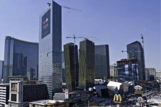 Eco-friendly resorts: Construction continues on the CityCenter on the Strip between Monte Carlo and Bellagio. Aria and Vdara were given the second-highest certification by the U.S. Green Building Council. 