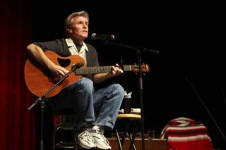 Musician Steve Cottrell entertains audience members with folk tunes such as 