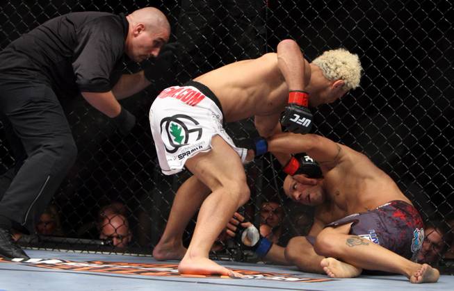 Josh Koscheck (red) prepares to hit Frank Trigg (blue) in a fight at UFC 103 at American Airlines Center in Dallas. Koscheck defeated Trigg.