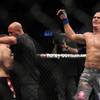 Junior Dos Santos (blue) celebrates after defeating Mirko Cro Cop (red) at UFC 103 at American Airlines Center in Dallas. Dos Santos defeated Cro Cop.