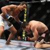 Vitor Belfort (blue) takes a swing at Rich Franklin (red) during UFC 103 at American Airlines Center in Dallas. Belfort defeated Franklin.