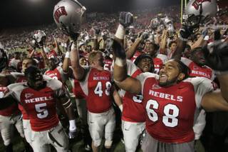 UNLV players celebrate their 34-33 defeat of Hawaii.