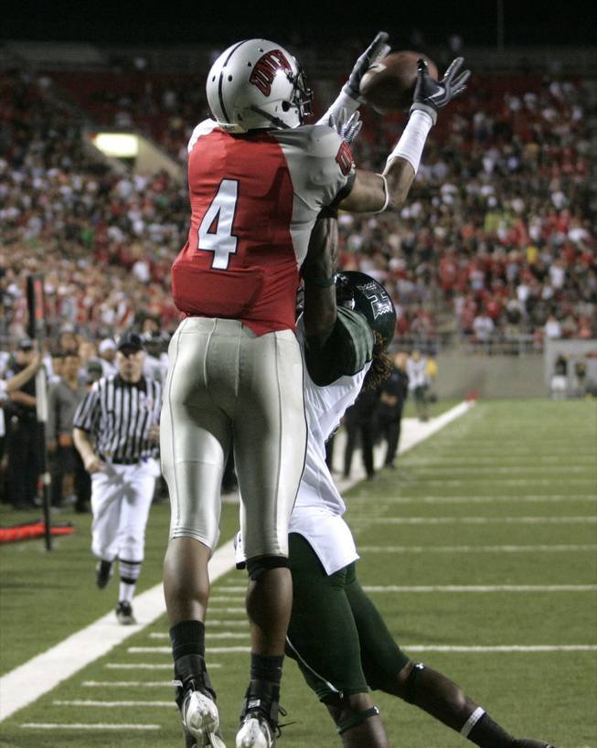 UNLV wide receiver Phillip Payne pulls in the game-winning touchdown over Hawaii's Tank Hopkins late in the fourth quarter in the Rebels' 34-33 victory at Sam Boyd Stadium on Saturday, Sept. 19, 2009.