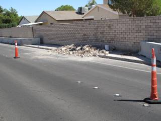 Debris from construction work to rebuild a block wall along Whitney Ranch Drive spills out into the street. Residents in the area have expressed concern about the buildup of piles like this one.