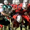 Liberty running back Teu Tai fights for yards during a game Friday at home against Green Valley. Liberty won 34-14.
