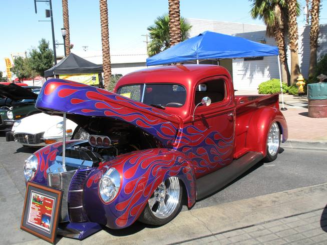 People gather at the 10th annual Super Run Car Show at 200 South Water St. in Henderson to view and display classic vehicles, including this 1940 Ford pickup.