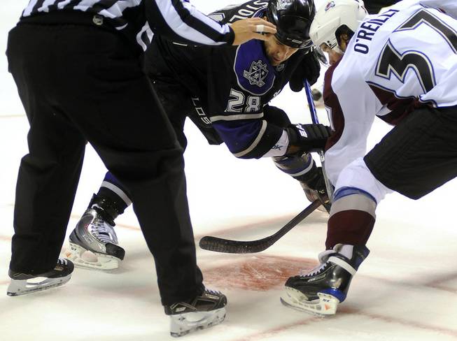 L.A. Kings center Jarret Stoll, left, faces off against Colorado Avalanche's Ryan O'Reilly during Frozen Fury XII at MGM Grand Garden Arena on Saturday, Sept. 26, 2009.