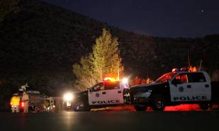 Metro Police and other agencies respond to Mount Charleston on Sunday evening to investigate a helicopter crash that injured three people. 
