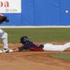 USA's Buck Coats, right, slides into second base as Cuba's Michel Enriquez waits for the ball at the Baseball World Cup gold medal game in Nettuno, Italy, Sunday Sept. 27, 2009. U.S. won 10-5. USA's Buck Coats, right, slides into second base as Cuba's Michel Enriquez waits for the ball at the Baseball World Cup gold medal game in Nettuno, Italy, Sunday Sept. 27, 2009. U.S. won 10-5.