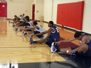 The defending national-champion Findlay Pilots stretch before practice Tuesday. Cory Joseph and Godwin Okonji are two seniors who will be soon taking more official college visits -- Joseph to UConn and Okonji to Hawaii.