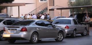 Metro Police investigate after an officer fatally shot a teenage boy Tuesday night in the eastern Las Vegas Valley. Authorities said he held a knife to a woman's throat.