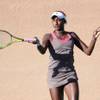 Asia Muhammad smashes a forehand against Heidi El-Tabakh on Wednesday during the first round of the Lexus of Las Vegas Open at Red Rock Country Club. Muhammad won 6-0, 2-0 (ret.) after El-Tabakh could not continue in the second set due to an undisclosed illness. 
