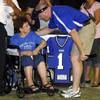 Basic High Principal David Bechtel greets Mary Maestas, mother of Chris Maestas, during a special ha