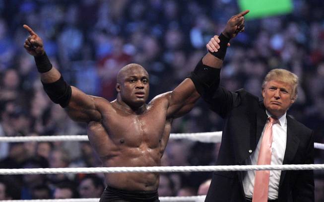 Donald Trump raises the arm of wrestler Bobby Lashley after he defeated Umaga at Wrestlemania 23 at Ford Field in Detroit, Sunday, April 1, 2007.