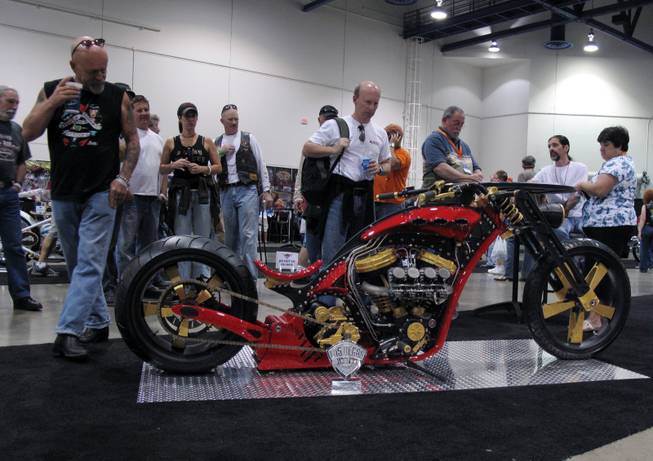 A crowd gathers around Mark Daley's custom motorcycle, which won the Artistry in Iron competition at the Las Vegas BikeFest on Friday.