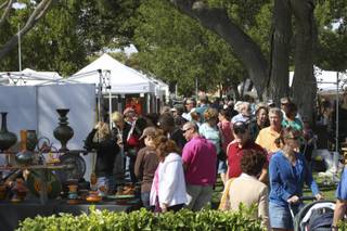 Hundreds of people ventured into the whipping winds around Bicentennial Park to admire the art Sunday during the 47th Annual Art in the Park in Boulder City.