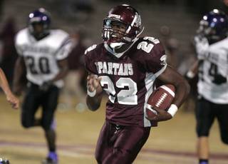 Cimarron-Memorial running back James Poole charges past the Durango defense for a touchdown.