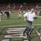 Photo: UNLV head coach Mike Sanford sprints off the field