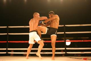 Odiz Ruiz delivers a knee to opponent Mike Dizak during MMA Xplosion at the M Resort.