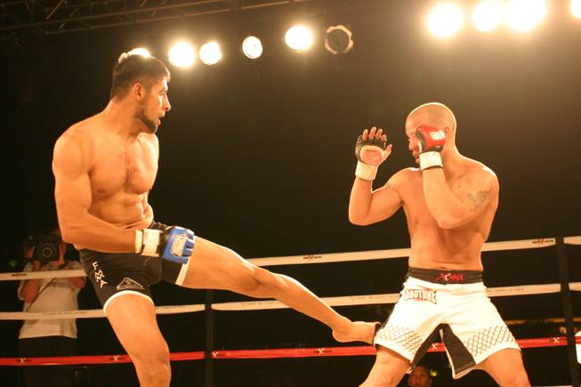 Odies Ruiz delivers a leg kick to Mike Dizak at MMA Xplosion at M Resort.