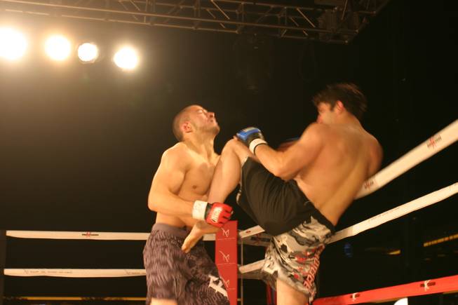 Dave Hulett delivers a blow to the chin of Blas Avena at MMA Xplosion at M Resort.