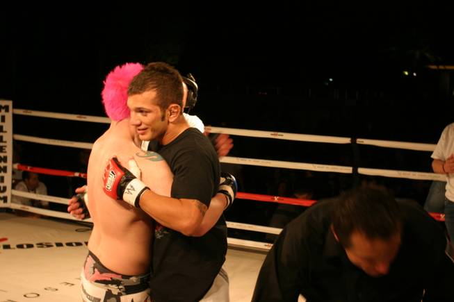 Steve Sharp embraces victorious John Gunderson at MMA Xplosion at the M Resort.
