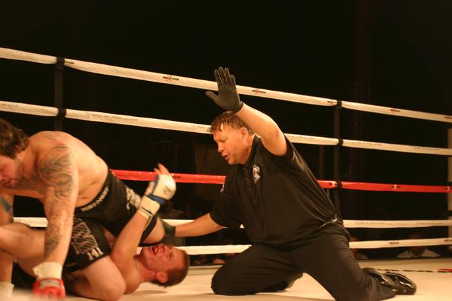 The referee calls an end to the bout between Matt Conte and Joe Angelo at MMA Xplosion at the M Resort.