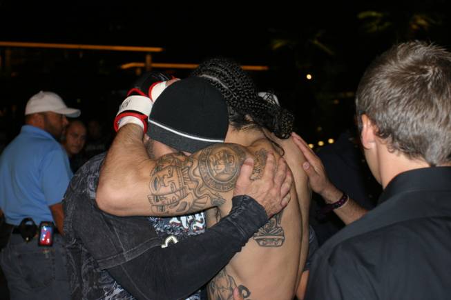 Javier Torres embraces a member of his corner team before going on to defeat Weston Duschen at MMA Xplosion at the M Resort.