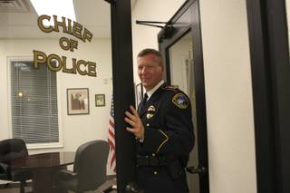 Police Chief Thomas Finn opens the door to his office while conducting a tour Wednesday of the newly renovated police station.
