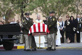 Honor guard members escort the casket of Metro Police Officer Milburn Beitel after his funeral Wednesday at Saint Elizabeth Ann Seton Roman Catholic Church in Las Vegas. Beitel died Oct. 8 at UMC hours after his cruiser crashed at Nellis Boulevard and Washington Avenue the previous evening.
