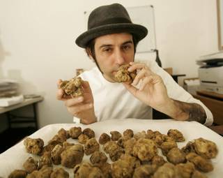 Joseph Magnano, West Coast district manager for Sabatino Truffles, inspects a fresh batch of truffles shipped from Italy. Magnano said his truffles cost around $150 an ounce. 
