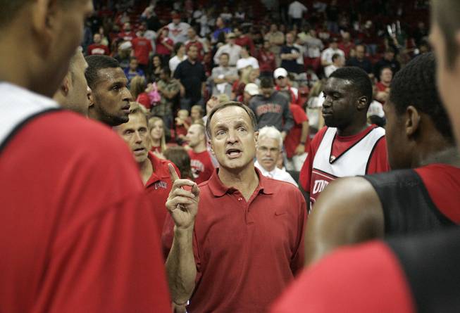 UNLV head coach Lon Kruger talks to his players after the Rebels FirstLook scrimmage Oct. 16 at the Thomas & Mack Center.