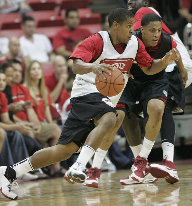 UNLV guard Steve Jones moves around guard Tre'Von Willis during the Rebels FirstLook scrimmage Oct. 16 at the Thomas & Mack Center.