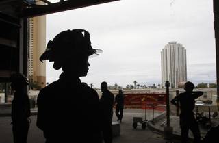 Firefighters, including Clark County firefighter Joe Ly, left, take part in a multi-agency fire training exercise at the stalled Fontainebleau Las Vegas resort project Monday, Oct. 12, 2009. The fire departments want to be sure they are prepared to work together in case of a fire in a high-rise casino.