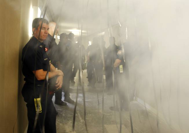 Las Vegas Fire Capt. Brian Gray watches theatrical smoke being ...