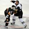 Las Vegas forward Kyle Hagel looks to throw a haymaker at former Wranglers pugelist J.D. Watt during a one-sided bout in the second period of the Wranglers season opener against the Grizzlies on Oct. 16.
