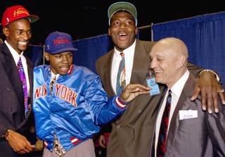 From left, former Rebels Stacey Augmon, Greg Anthony and Larry Johnson celebrate with coach Jerry Tarkanian in New York City at the 1991 NBA Draft, when all three were selected in the first round. Players from UNLV's glory days, such as these three, have been welcomed back warmly around the program in recent years since coach Lon Kruger took over.