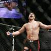 Lyoto Machida celebrates his second round knockout victory over Rashad Evans during their UFC light heavyweight mixed martial arts match Saturday, May 23, 2009 at The MGM Grand Garden Arena in Las Vegas.