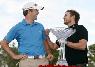Martin Laird of Scotland jokes with entertainer Justin Timberlake after winning the 2009 Justin Timberlake Shriners Hospitals for Children Open on Sunday, Oct. 18, 2009. 
