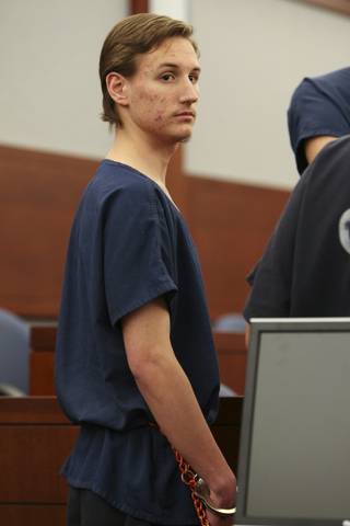 Jonathan Weaver, 21, looks around the courtroom while appearing before Judge James Bixler on Monday at the Regional Justice Center. Weaver was arrested on charges of abuse and neglect, child endangerment, kidnapping and attempted murder after leaving his girlfriend's two toddlers bound and gagged in their car seats on the floor of a garage in June.