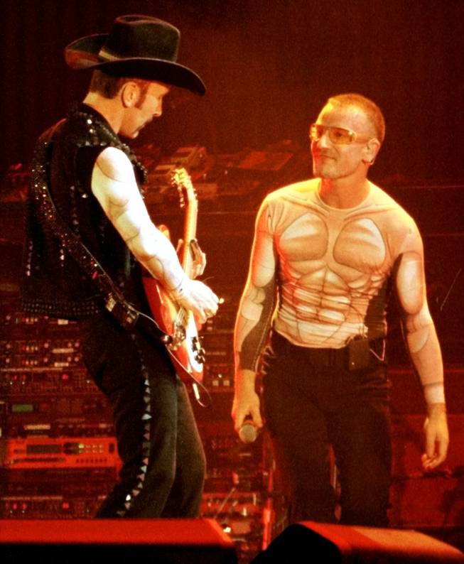 Edge and Bono, rockin' it out in a muscular way at Sam Boyd Stadium in April 1997.